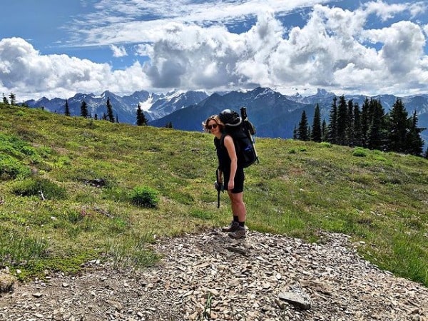 Picture of Eloise Mumford with an amazing view of mountain and sky